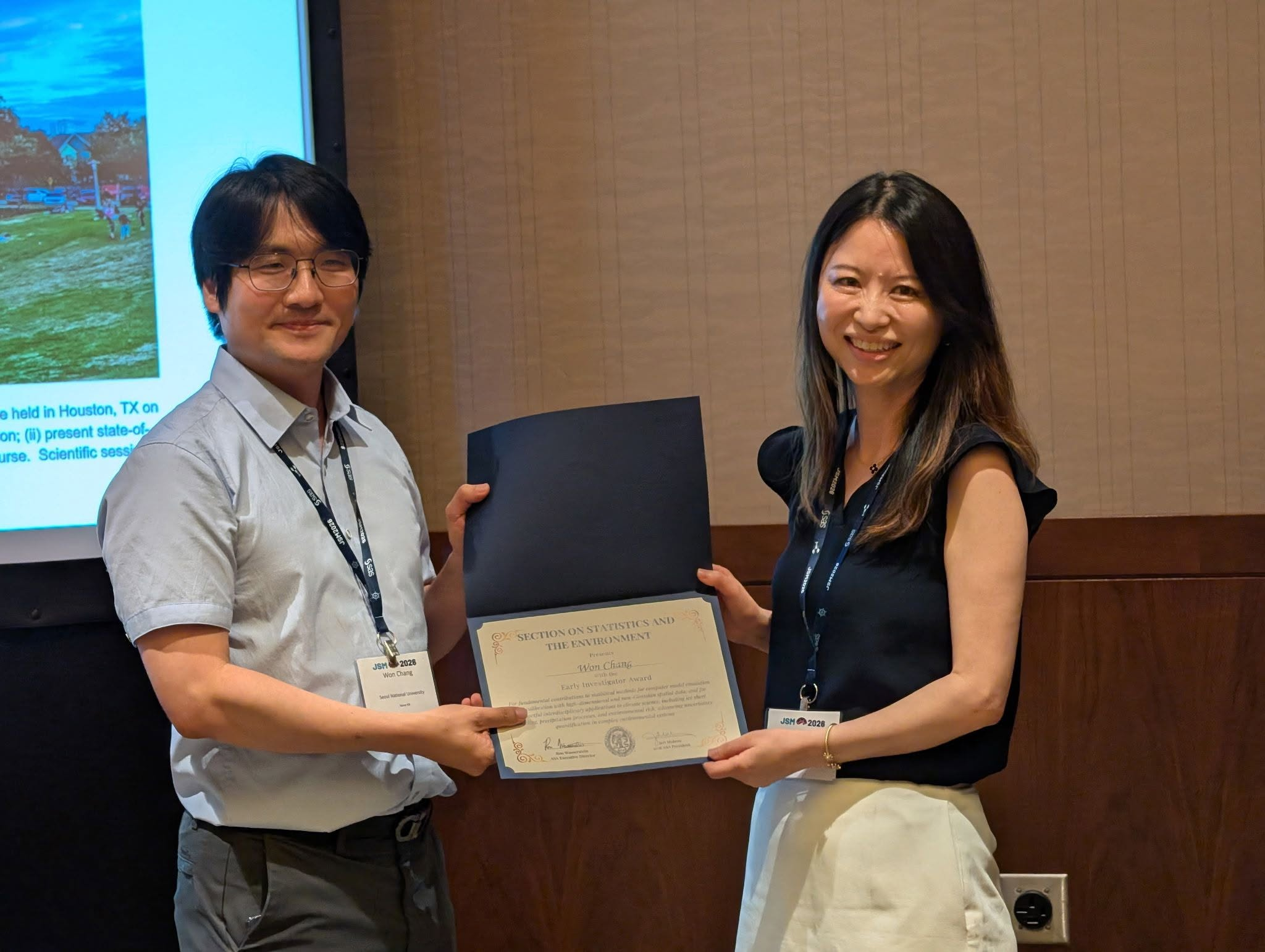 Professor Won Chang receiving the ASA Section on Statistics and the Environment Early Investigator Award certificate at JSM 2026